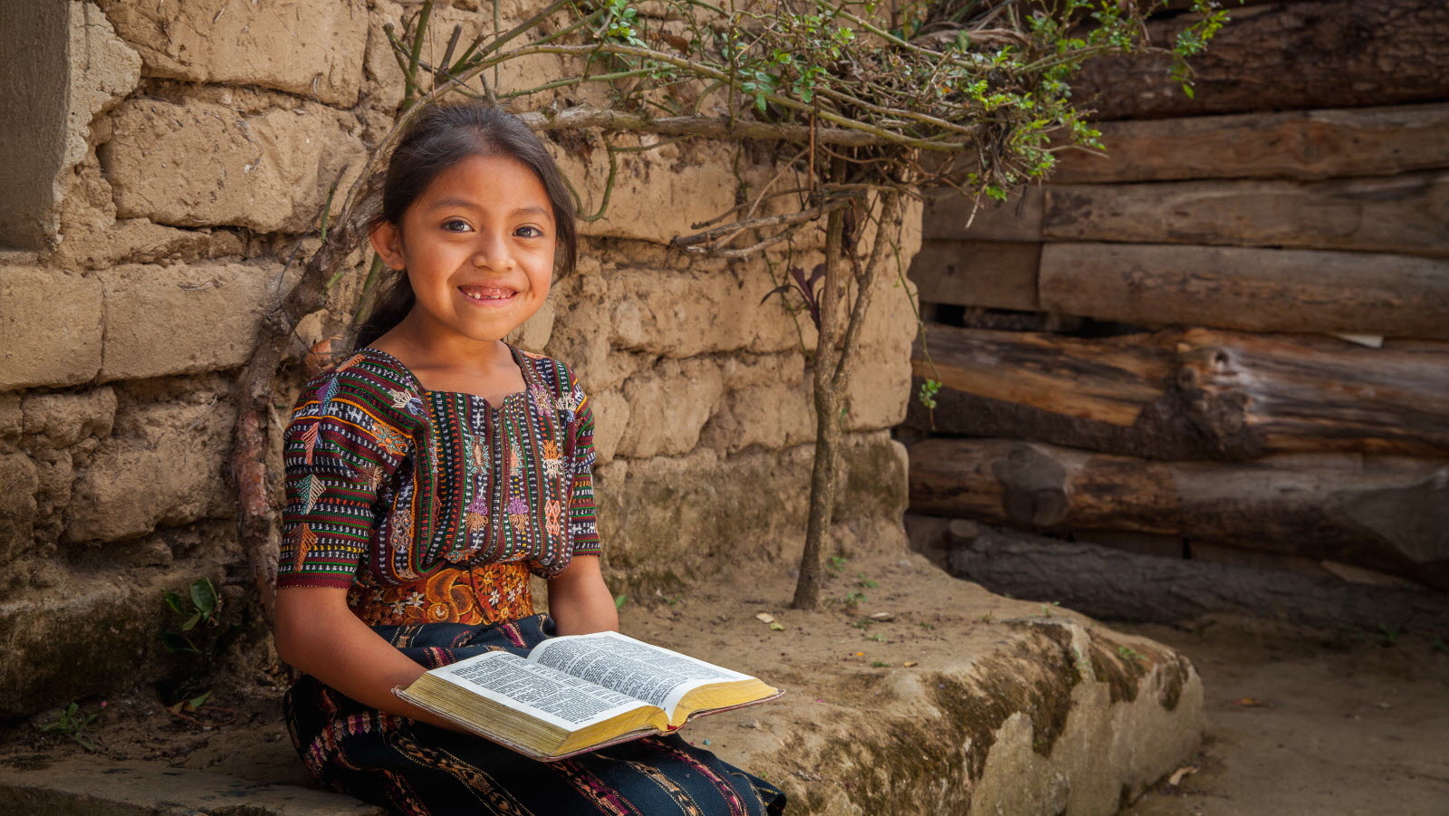 Yennifer, age 6, holds her family's bible. She lives in Guatemala. ©2015 World Vision, Lindsey Minerva.