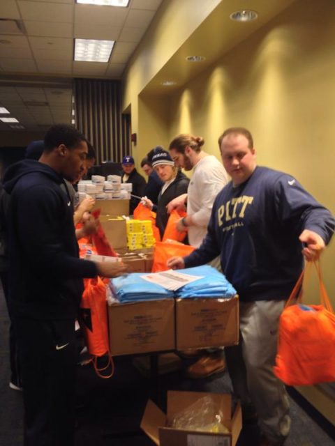 The University of Pittsburgh football team and World Vision partnered to build Ebola Caregiver Kits for health workers in Sierra Leone. PHOTO: Courtesy, University of Pittsburgh